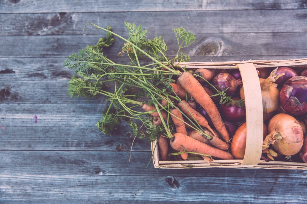 basket of carrots and onions